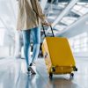 International airport terminal. Asian beautiful woman with luggage and walking in airport