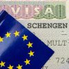 Close-up of Schengen visa with flag of EU