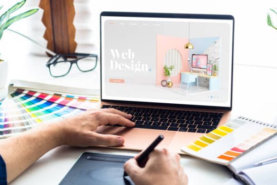 Web design desktop with  laptop and tools